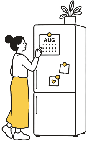 A person putting a calendar magnet on a refrigerator